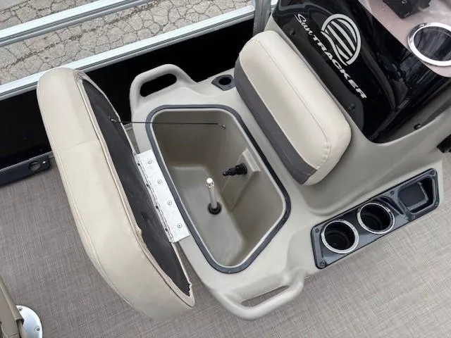 Slide: The Image of Interior of 2021 Sun Tracker Bass Buggy 16 XL with storage compartment and cup holders. - 13