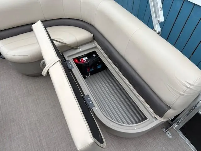 Slide: The Image of 2021 Sun Tracker Bass Buggy 16 XL pontoon boat with open storage compartment. - 20