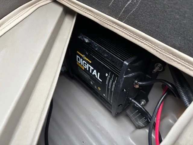 Slide: The Image of Digital charger installed in a 2021 Sun Tracker Bass Buggy 16 XL boat compartment. - 22