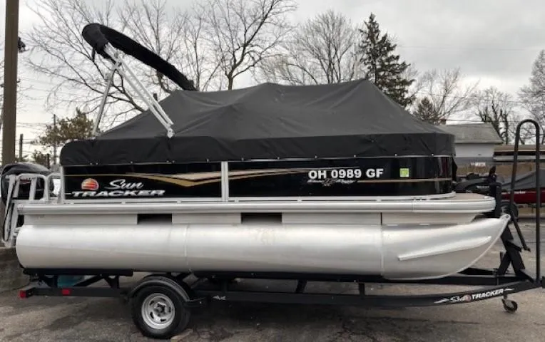 Slide: The Image of 2021 Sun Tracker Bass Buggy 16 XL pontoon boat with cover on trailer. - 25