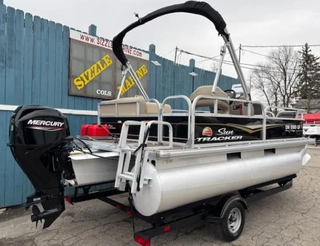 Slide: The Image of 2021 Sun Tracker Bass Buggy 16 XL pontoon boat with Mercury engine on trailer. - 3
