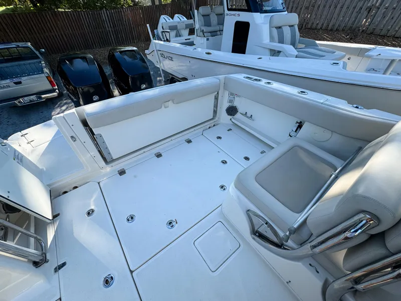 Slide: The Image of 2017 Boston Whaler 320 Vantage boat interior with seating and storage compartments. - 10