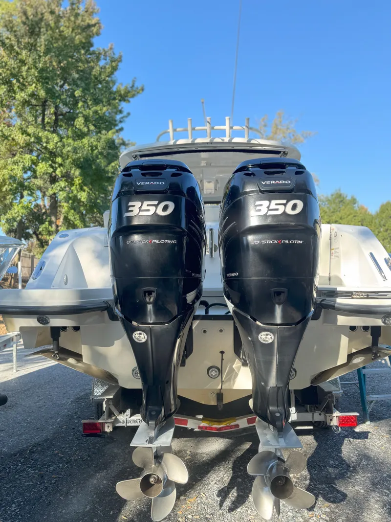 Slide: The Image of 2017 Boston Whaler 320 Vantage with twin 350 Verado engines, parked outdoors. - 3