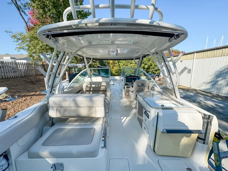 Slide: The Image of 2017 Boston Whaler 320 Vantage boat interior with seating and helm station. - 7