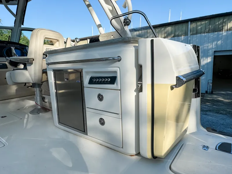 Slide: The Image of 2017 Boston Whaler 320 Vantage interior with seating and storage compartments. - 9