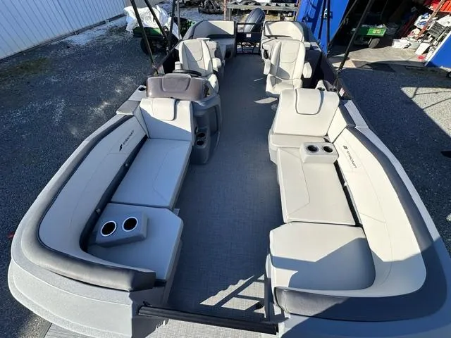Slide: The Image of 2025 Starcraft GX 22 R DH boat interior with spacious seating and cup holders. - 4
