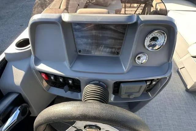 Slide: The Image of Dashboard of 2025 Starcraft GX 22 R DH boat with steering wheel and controls. - 7