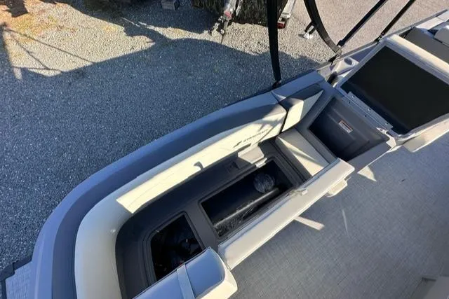 Slide: The Image of 2025 Starcraft GX 22 R DH boat interior with seating and storage compartments. - 8