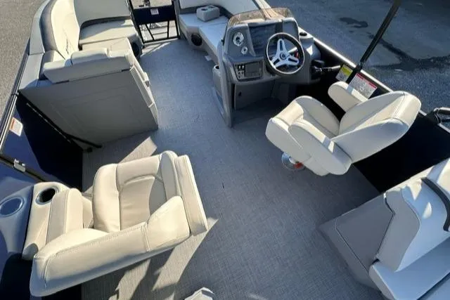 Slide: The Image of Interior of 2025 Starcraft GX 22 R DH boat with plush seating and modern dashboard. - 9