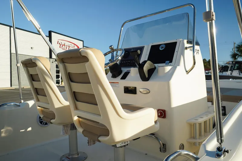 Slide: The Image of 2025 Scout 175 Sportfish boat interior with dual seats and control panel. - 8