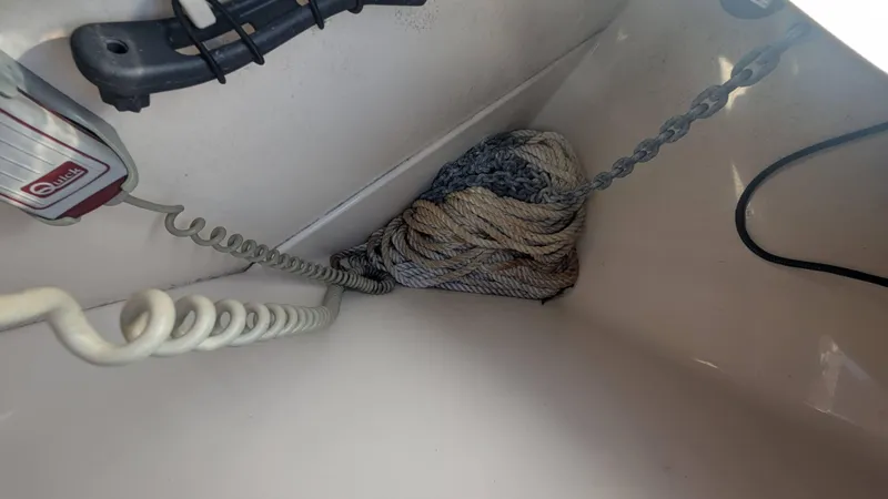 Slide: The Image of Coiled rope and chain in a 2014 Boston Whaler 315 Conquest boat compartment. - 22