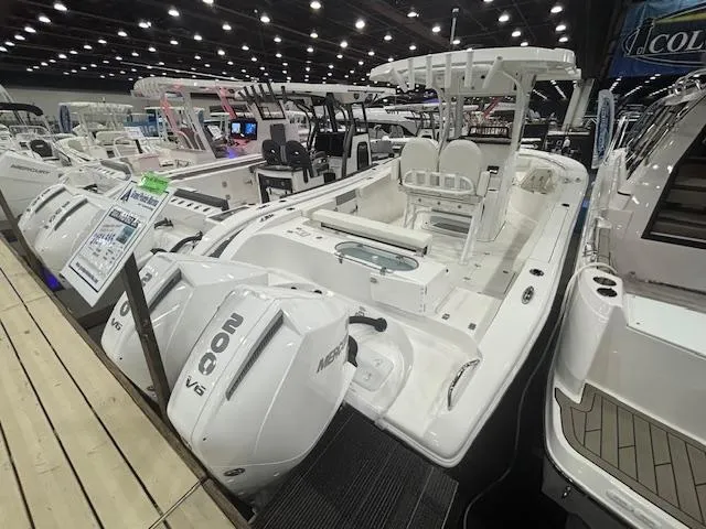 The Image of 2025 Sea Pro 262 Offshore boat on trailer, side view, light blue hull. - 0