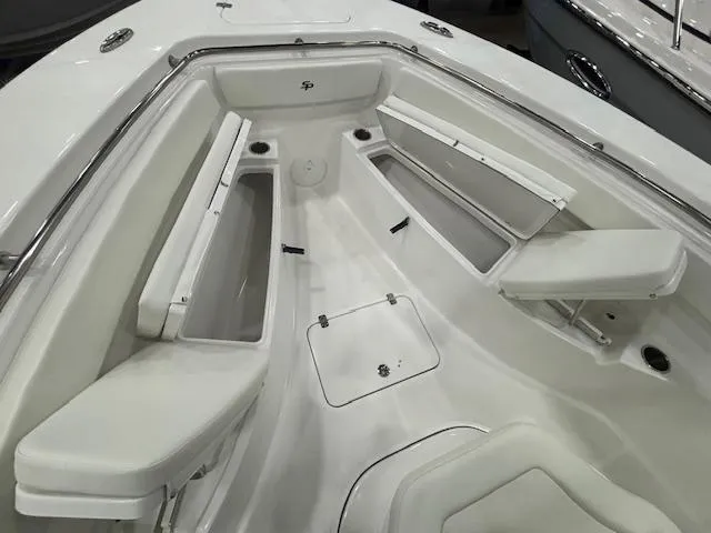 Slide: The Image of 2025 Sea Pro 262 Offshore boat with dual outboard engines in a showroom. - 10
