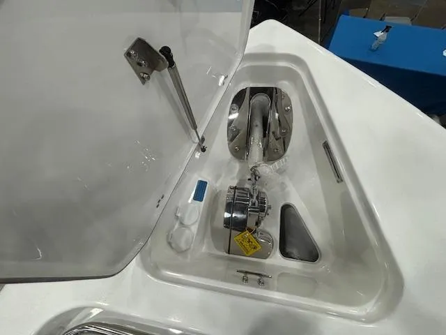 Slide: The Image of 2025 Sea Pro 262 Offshore boat with dual 600 V8 engines in a garage setting. - 11