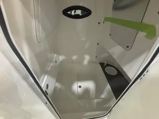 Slide: The Image of Interior cabin of 2025 Sea Pro 262 Offshore boat, featuring sleek white design. - 24