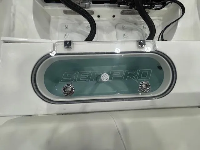 Slide: The Image of 2025 Sea Pro 262 Offshore boat on trailer in indoor showroom. - 3
