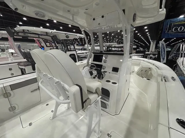 Slide: The Image of 2025 Sea Pro 262 Offshore boat on trailer in indoor showroom. - 4