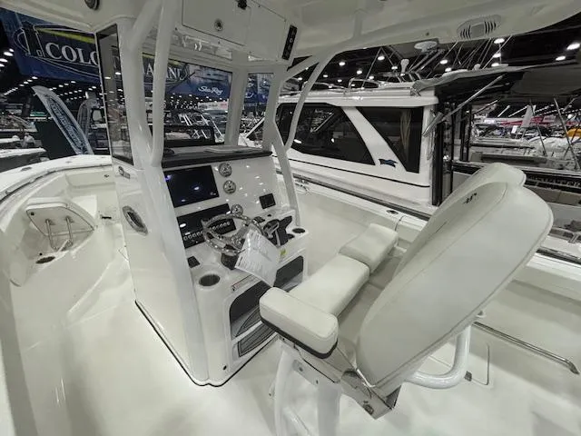 Slide: The Image of 2025 Sea Pro 262 Offshore boat with dual Mercury engines on a trailer. - 7