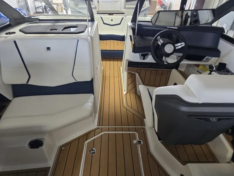 Slide: The Image of 2025 Nautique Super Air Nautique G23 interior with sleek design and modern dashboard. - 14