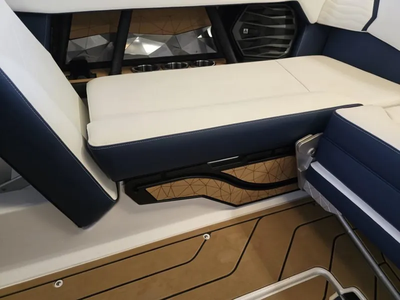 Slide: The Image of 2025 Nautique Super Air Nautique G23 interior seating with modern design and luxurious upholstery. - 15