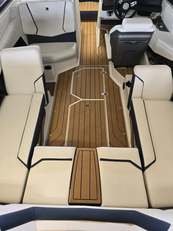 Slide: The Image of 2025 Nautique Super Air Nautique G23 interior with luxurious seating and sleek design. - 20
