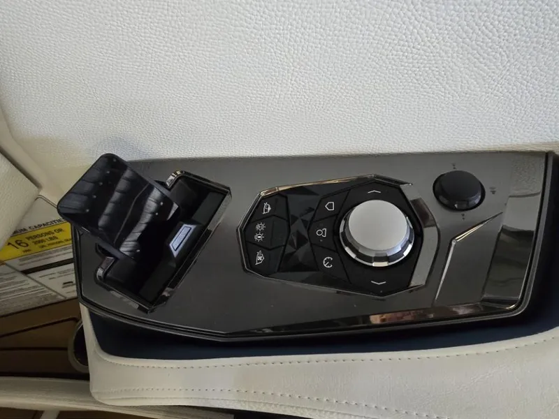 Slide: The Image of Control panel of 2025 Nautique Super Air Nautique G23 boat, featuring sleek design and buttons. - 31