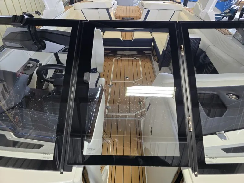 Slide: The Image of 2025 Nautique Super Air Nautique G23 interior with sleek design and modern dashboard. - 38
