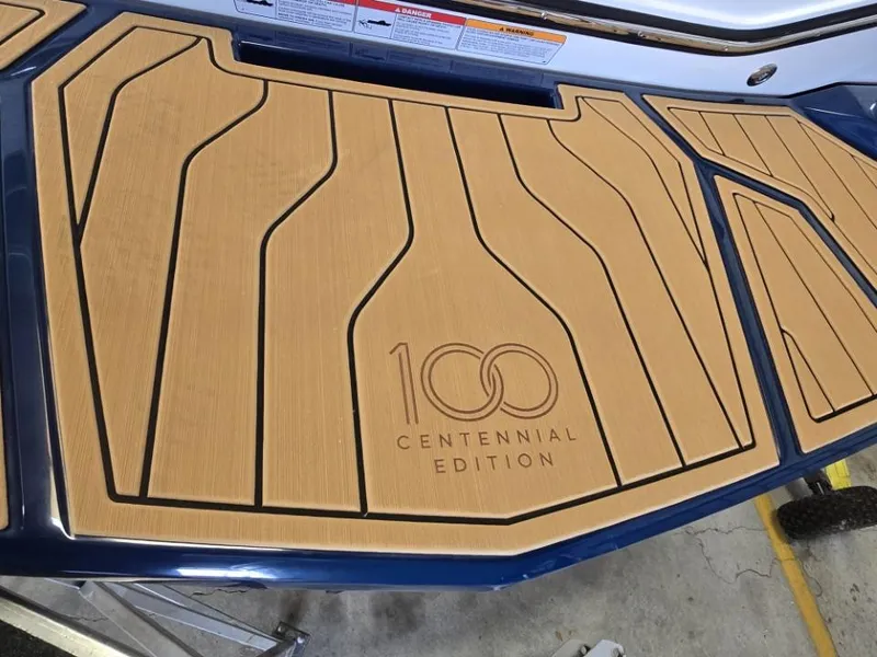 Slide: The Image of 2025 Nautique Super Air Nautique G23 Centennial Edition deck with elegant wood finish. - 42