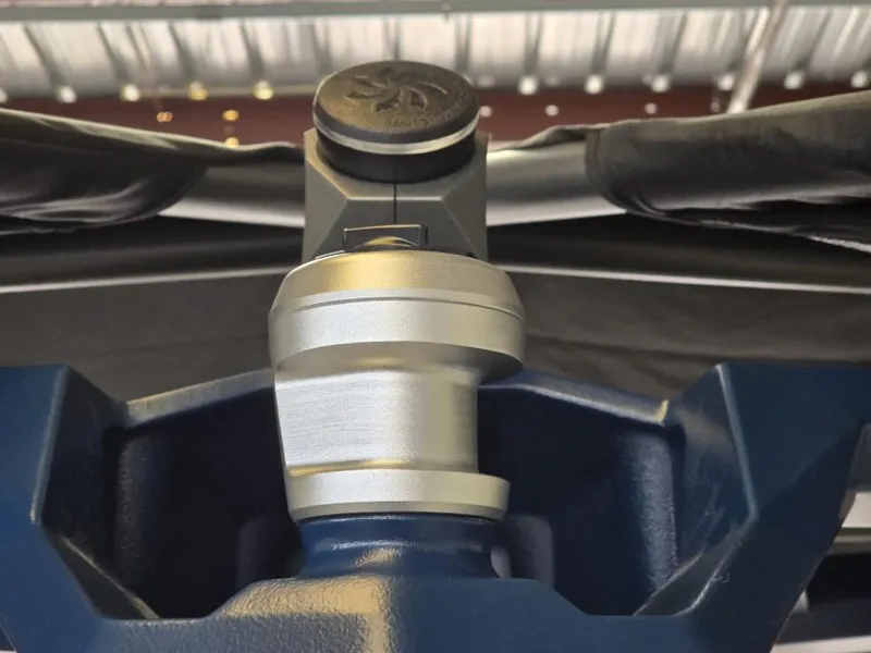 Slide: The Image of Close-up of 2025 Nautique Super Air Nautique G23 boat component under a metal roof. - 6