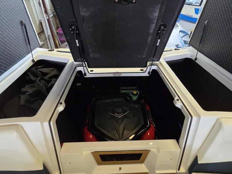 Slide: The Image of 2025 Nautique Super Air Nautique G23 engine compartment with open hatches. - 7