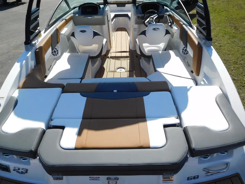Slide: The Image of 2025 Chaparral 23 SSi boat interior with luxurious seating and modern design. - 11