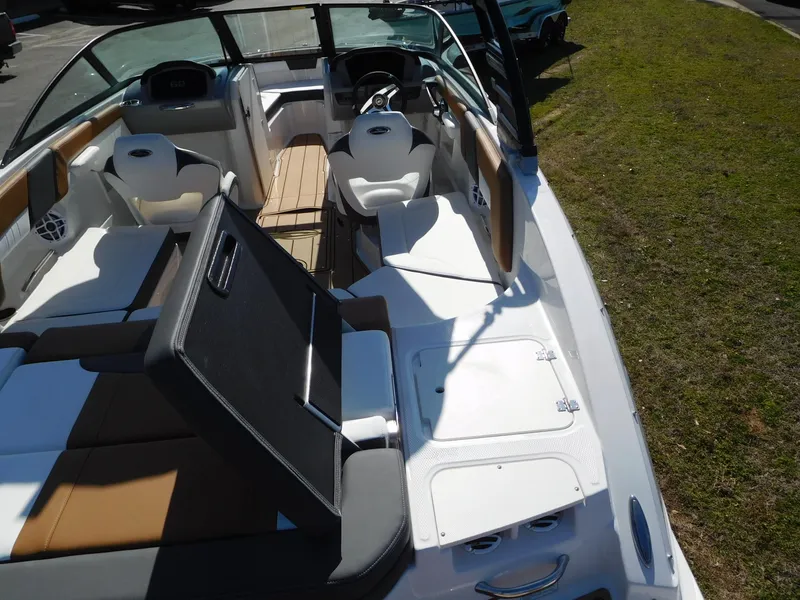 Slide: The Image of 2025 Chaparral 23 SSi boat interior with seating and dashboard view. - 9
