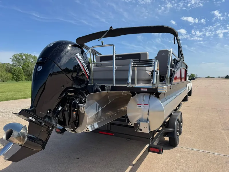 Slide: The Image of 2025 Barletta ARIA 22UC pontoon boat with Mercury outboard motor on a trailer. - 11