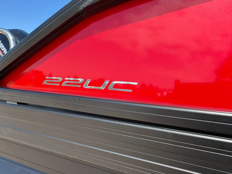 Slide: The Image of 2025 Barletta ARIA 22UC boat, red exterior with model emblem. - 19