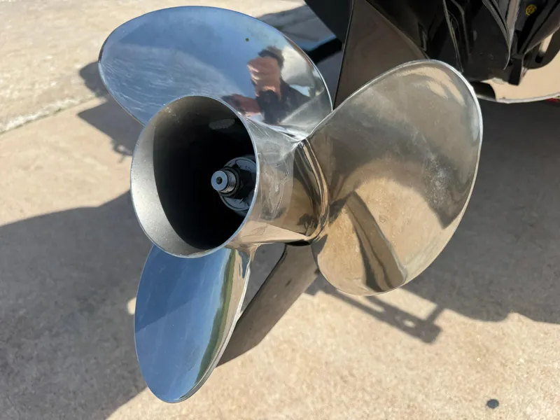 Slide: The Image of Shiny propeller of 2025 Barletta ARIA 22UC boat on concrete surface. - 21