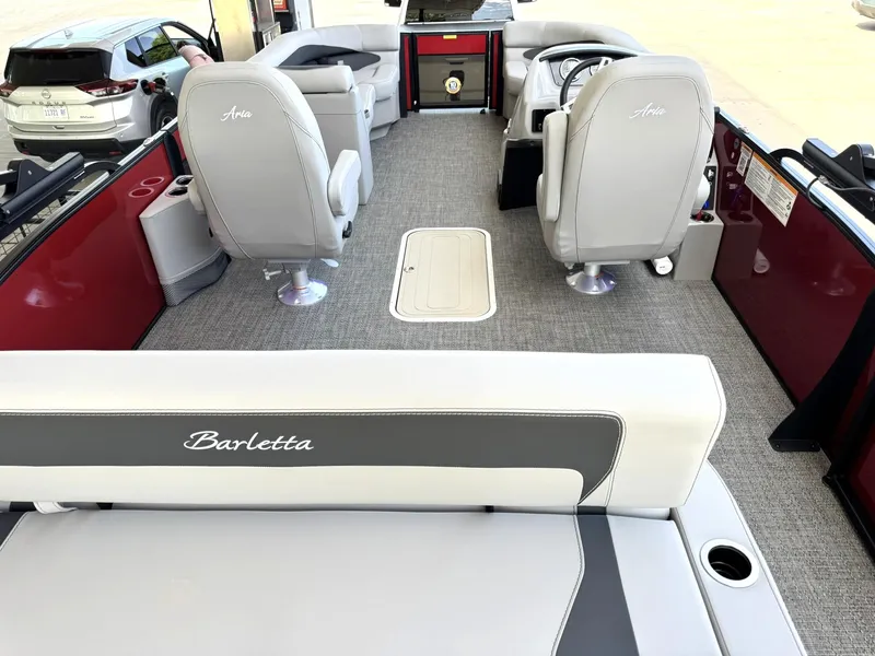 Slide: The Image of 2025 Barletta ARIA 22UC pontoon boat interior with gray seating and modern design. - 24