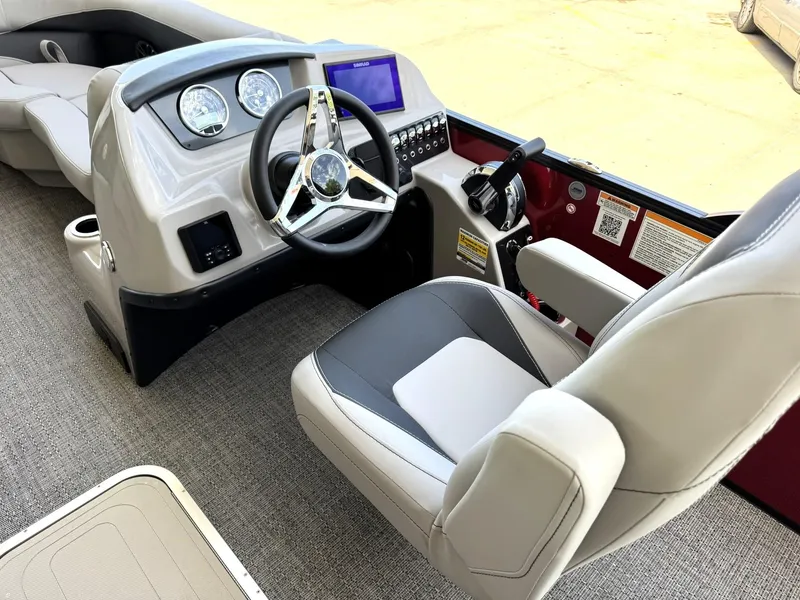 Slide: The Image of 2025 Barletta ARIA 22UC boat cockpit with steering wheel and control panel. - 25