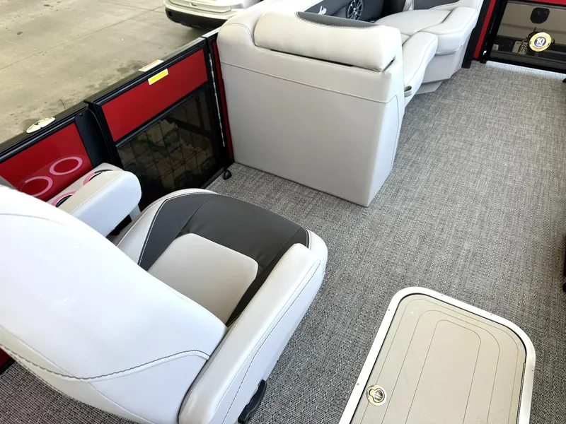 Slide: The Image of 2025 Barletta ARIA 22UC interior with modern seating and carpeted flooring. - 26