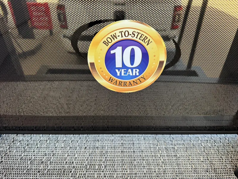 Slide: The Image of 10-year warranty badge on Barletta ARIA 22UC 2025 model boat. - 30