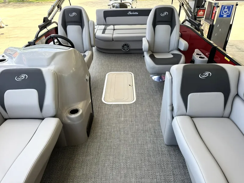 Slide: The Image of 2025 Barletta ARIA 22UC pontoon boat interior with gray seating and modern design. - 33