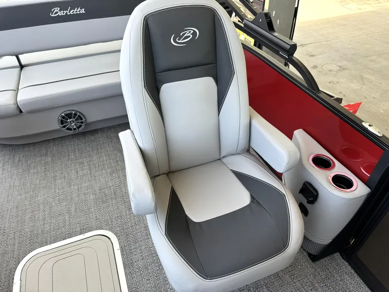 Slide: The Image of 2025 Barletta ARIA 22UC boat interior with gray captain's chair and cup holders. - 34