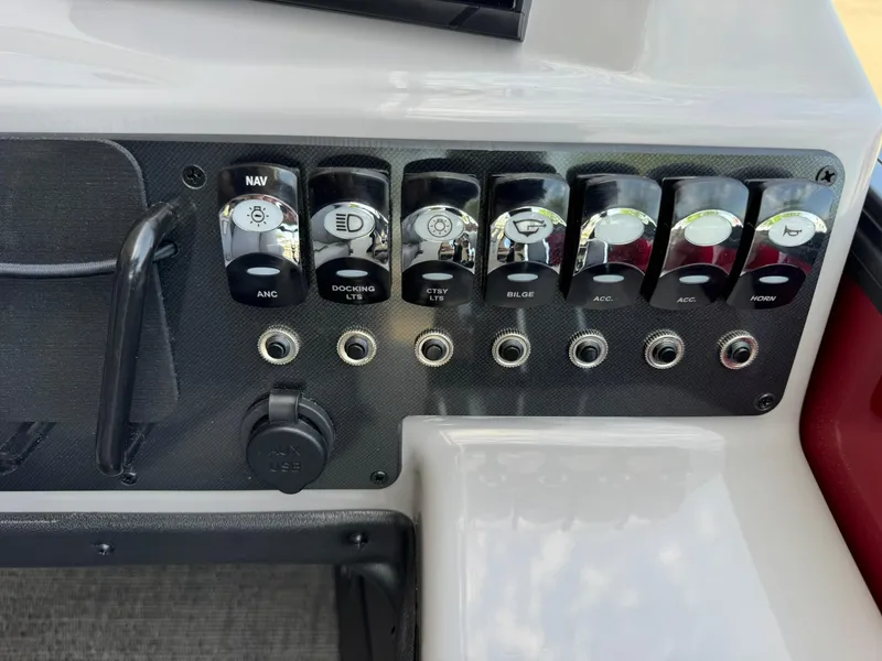 Slide: The Image of Control panel of 2025 Barletta ARIA 22UC boat with labeled switches. - 39