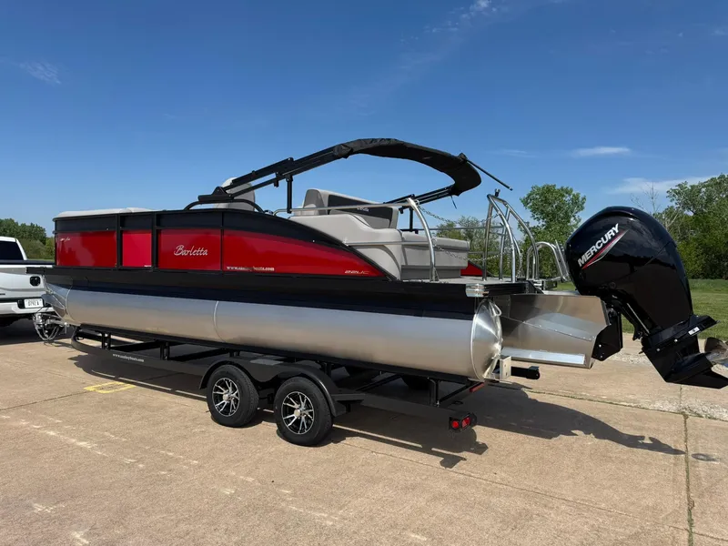 Slide: The Image of 2025 Barletta ARIA 22UC pontoon boat on trailer, featuring a sleek red and silver design. - 7