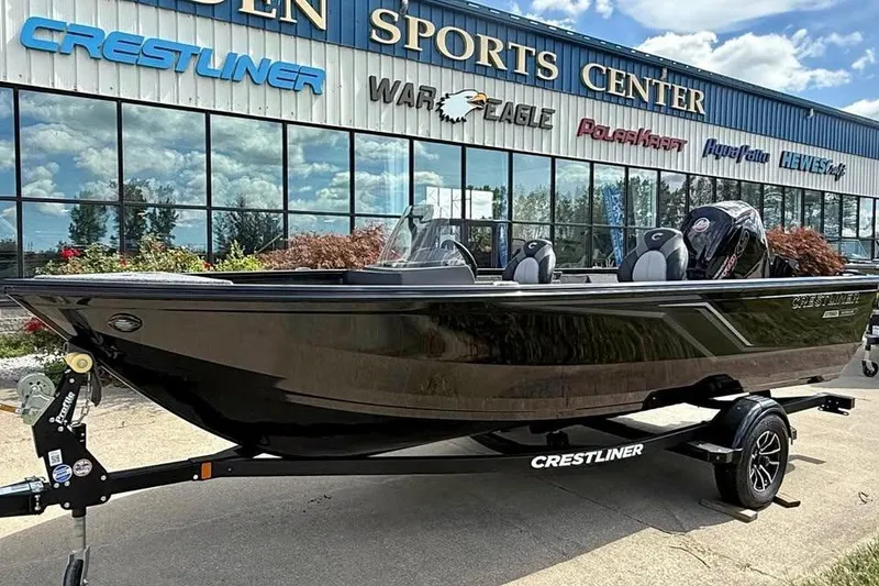 The Image of 2025 Crestliner 1750 Hawk SC boat on trailer outside dealership. - 0