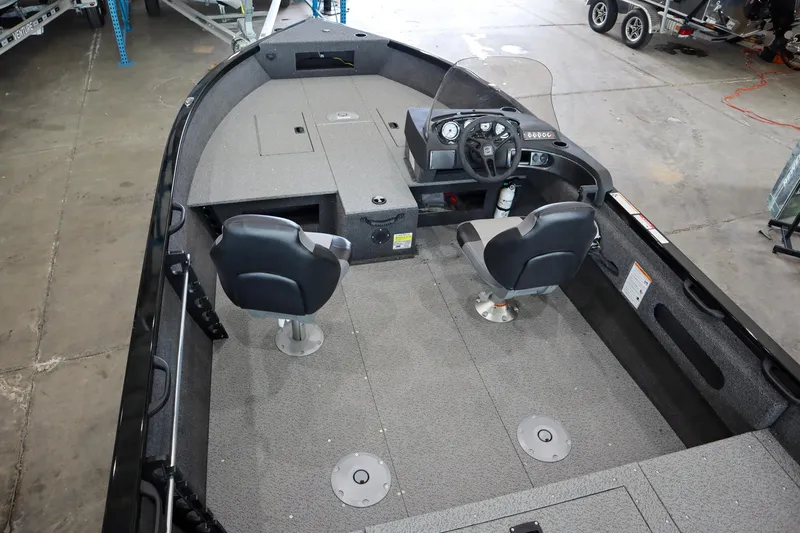 Slide: The Image of 2025 Crestliner 1750 Hawk SC boat interior with dual seats and steering console. - 10