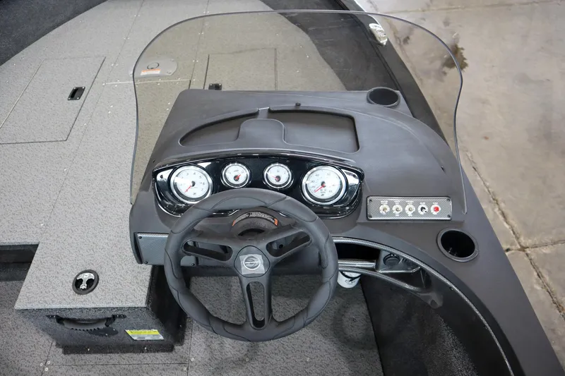 Slide: The Image of 2025 Crestliner 1750 Hawk SC dashboard with steering wheel and gauges. - 12