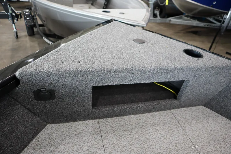 Slide: The Image of 2025 Crestliner 1750 Hawk SC boat interior with carpeted storage compartment. - 14