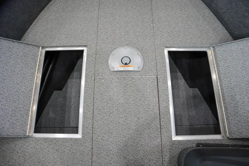 Slide: The Image of 2025 Crestliner 1750 Hawk SC boat interior with open storage compartments. - 15