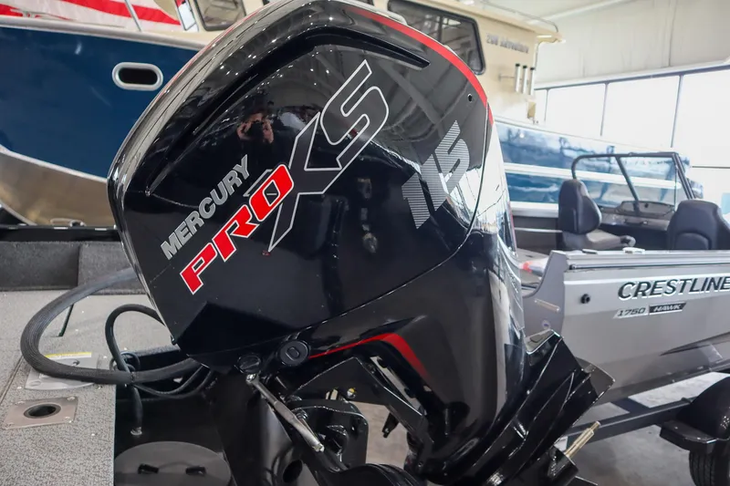 Slide: The Image of 2025 Crestliner 1750 Hawk SC with Mercury Pro XS outboard motor in showroom. - 19