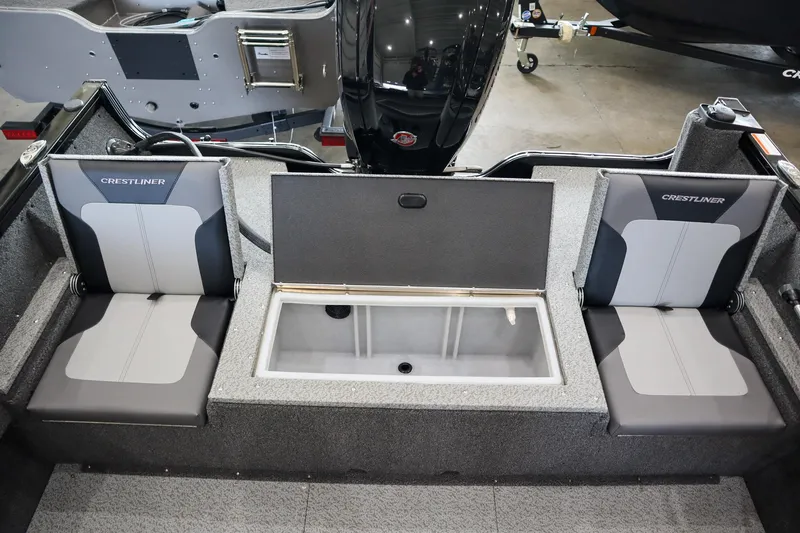 Slide: The Image of 2025 Crestliner 1750 Hawk SC boat interior with seating and storage compartment. - 6